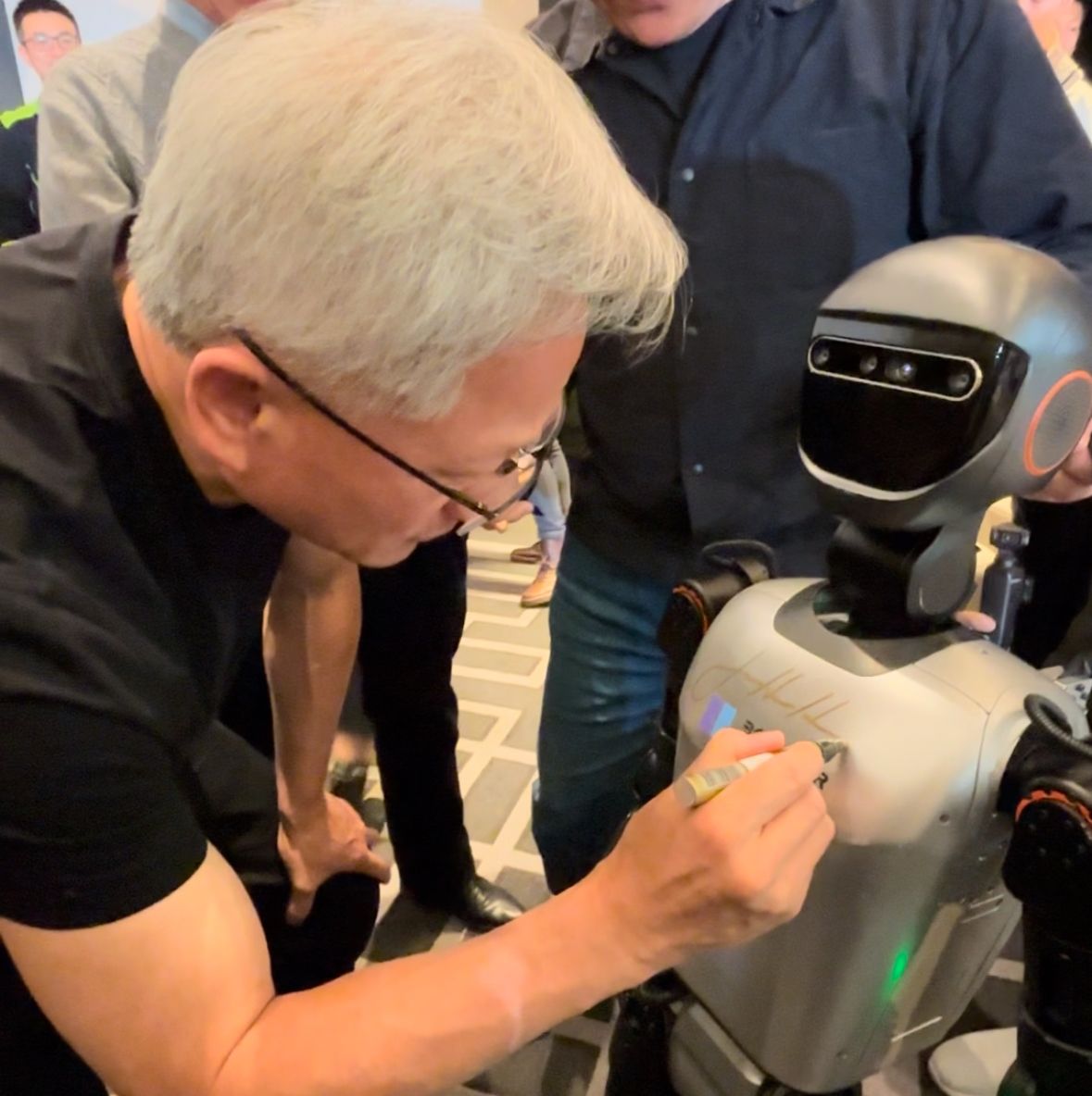 Booster T1 at NVIDIA's Spring Party, Ships in Global Volumes and Gets Signed by Jen-Hsun Huang